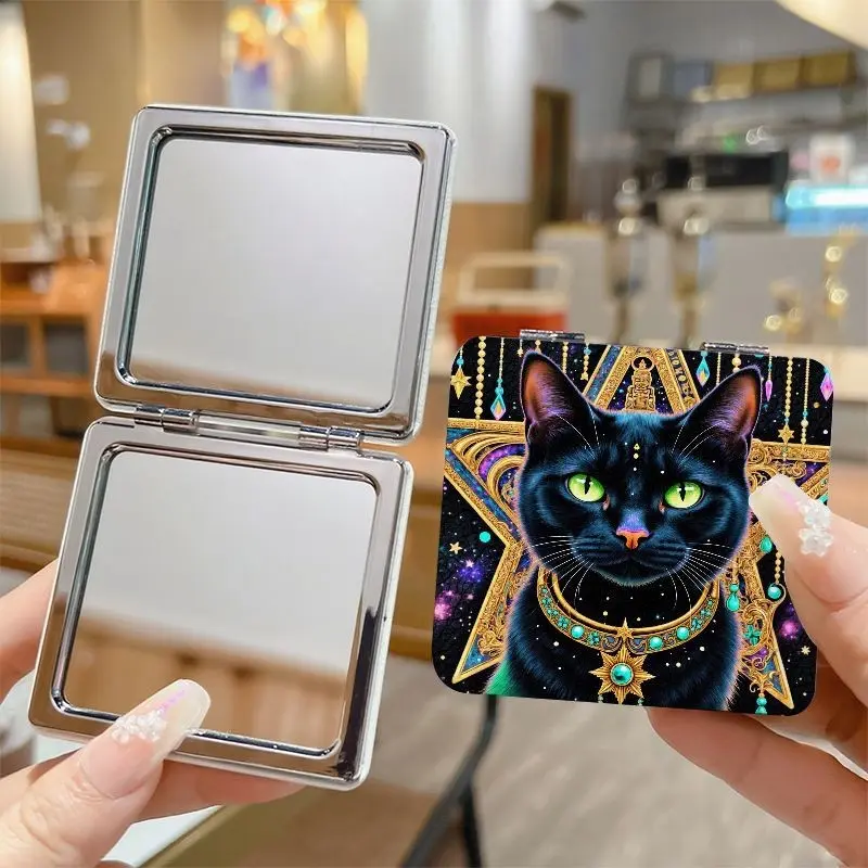 Double‑Sided Portable Folding Compact Mirror, Ornate Black Cat Design with Emerald Green Eyes & Pink Nose, Gold‑Turquoise Jewel Accents, Cosmic Starry Sky Background, Decorative Square Shape with Intricate Patterns, Perfect for Cozy Cafe‑Style Vibe