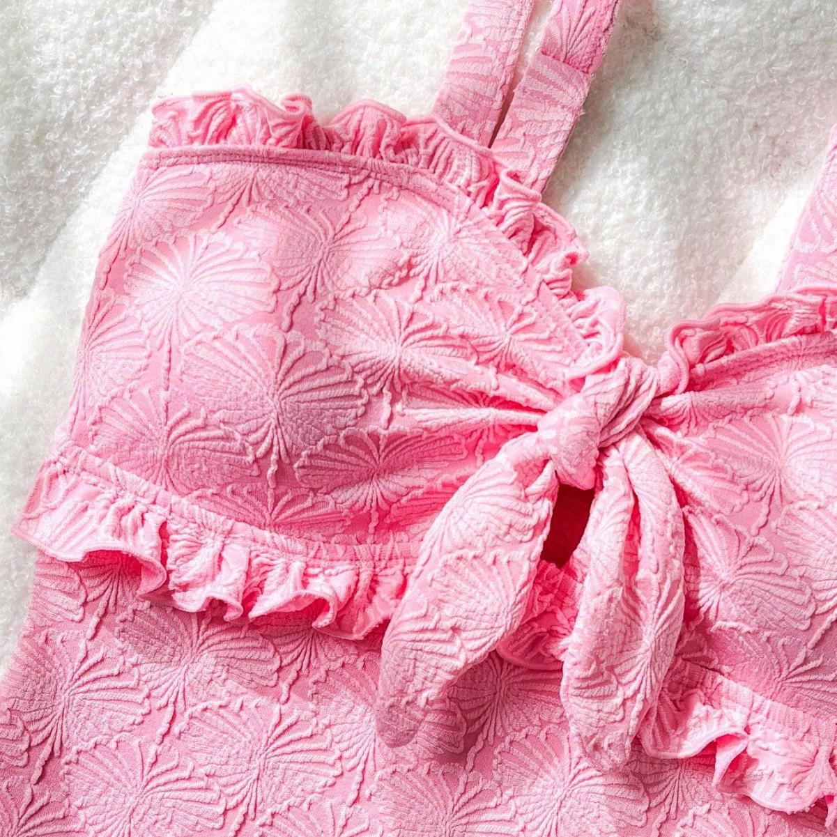 Cute & Feminine Pink One-Piece Swimsuit – Bow Tie & Ruffle Design