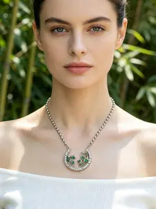This bamboo leaf studded diamond necklace features a full diamond crescent shape paired with emerald green bamboo leaves, making it suitable for daily wear, vacation dates, and other occasions. It is also a surprising and exquisite small gift.