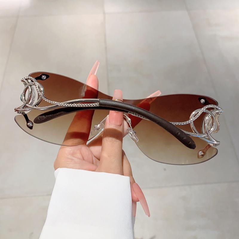Y2K Rimless Luxury Brand Designer Sunglasses Women For Men One Piece Trendy Oversized Sun Glasses Metal Snake Pink Punk Shades durable SpringStatements