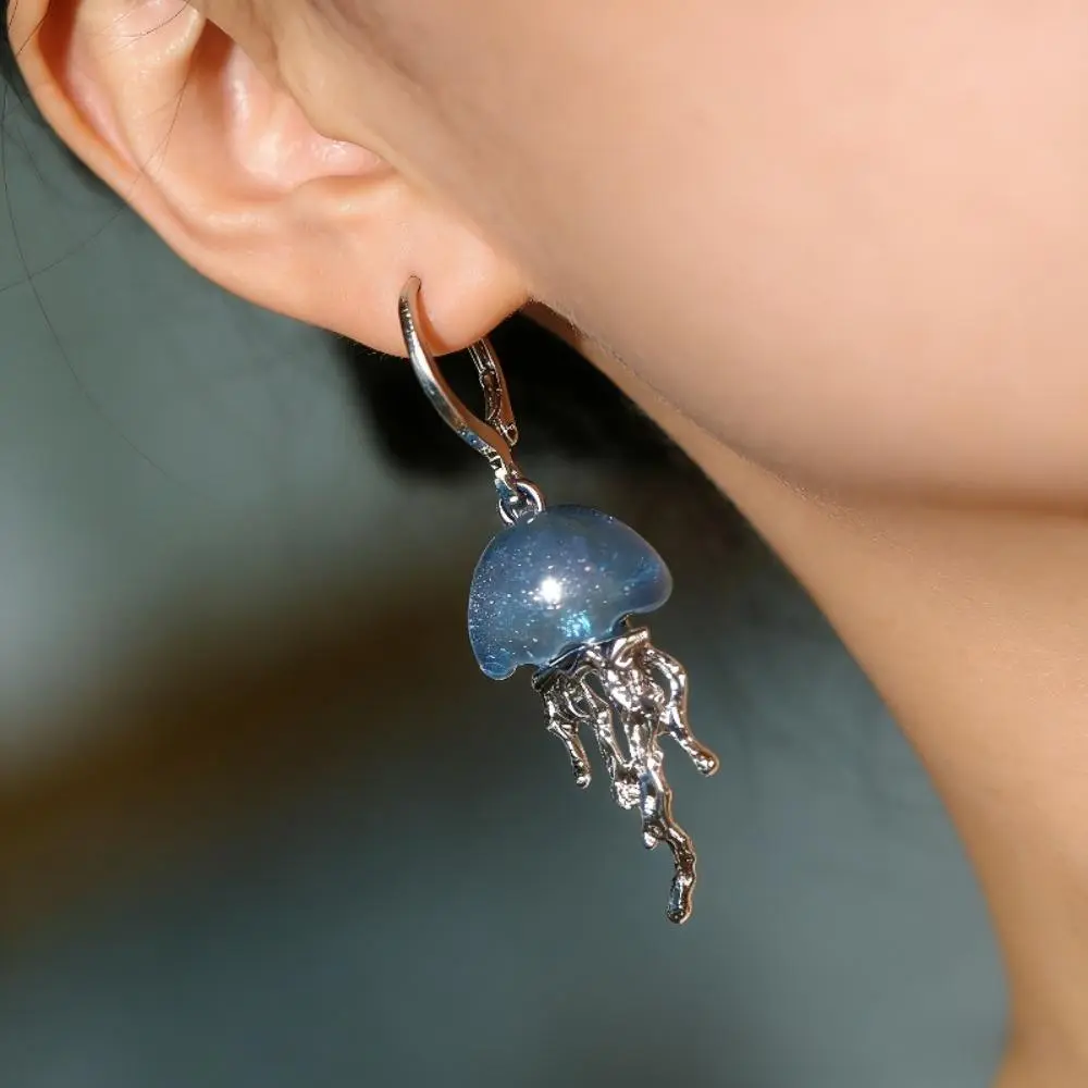 Jellyfish Dangle Hoop Earrings for Women, Blue Glitter Resin with Irregular Silver Tentacles, Lightweight Whimsical Ocean Jewelry, Glitter Jellyfish, Hoop Dangles, Irregular Tentacles, Ocean Theme, Resin & Metal, Bell Shape