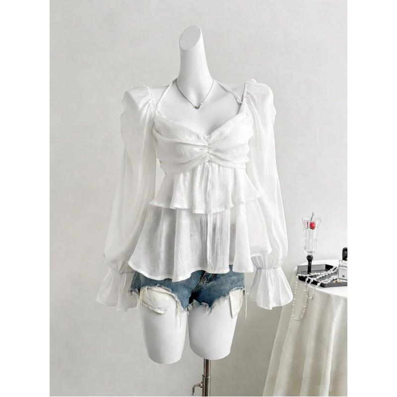 Elegant French-style sheer fabric blouse with ribbon ties and ruffled long sleeves for women, featuring ruffles, asymmetrical design, knotted detail, solid color, bell sleeves, suitable for spring, summer, and autumn