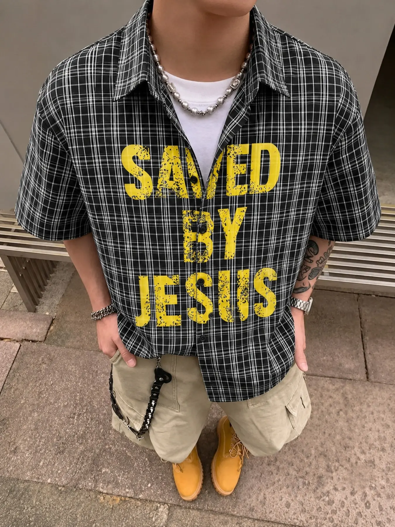 Men's Black and White Plaid Shirt, Saved By Jesus Yellow Graphic Short Sleeve Button-Up, Loose Fit Christian Streetwear Top, Y2K Faith Fashion for Summer, Church Events, Campus Outfits, Casual Outings, Weekend Gatherings, and Everyday Wear