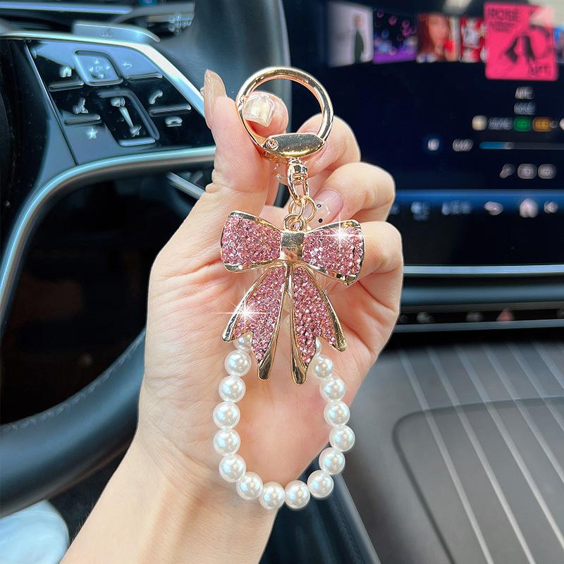 Rhinestone Bow Keychain with Pearl Wrist Strap, Luxury Bling Bow Car Key Ring, Elegant Metal Bag Charm Accessory for Women Rhinestone Bow Keychain with Pearl Wrist Strap, Luxury Bling Bow Car Key Ring, Elegant Metal Bag Charm Accessory for Women