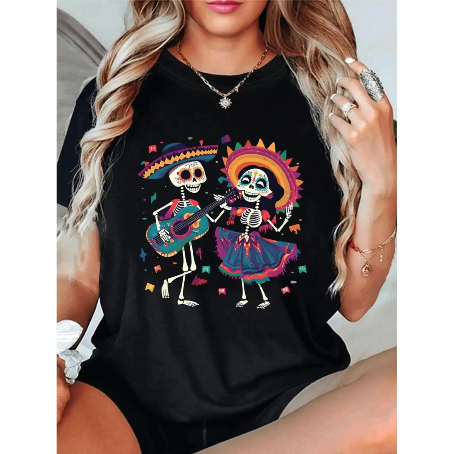Vibrant Folk Art Skeleton Dance T-Shirt for Women Celebrate Spring and Summer with a Colorful Graphic Print Featuring Skulls and Guitar Design