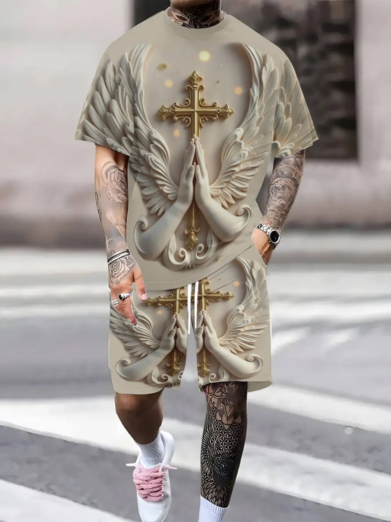 Men's summer casual sportswear set, featuring a printed gold cross with wings and praying hands design. The lightweight, breathable short-sleeved t-shirt and shorts are a two-piece set, suitable for outdoor leisure and everyday street style.