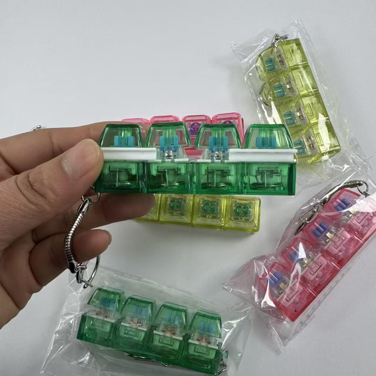 4-key decompression button, Russian Tetris keychain, mechanical key with light-emitting function, stress-reducing fingertip toy key.