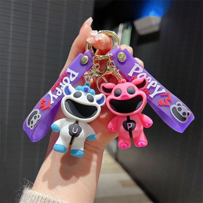 Smiling critters scary smiling animal doll keychain pink piggy blue elephant pendant