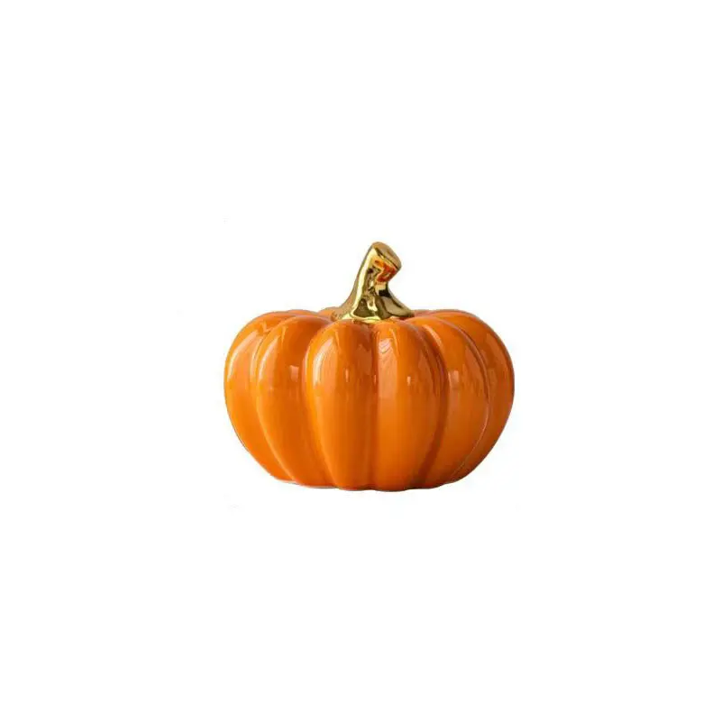 Halloween and Christmas ceramic pumpkin ornaments, with glossy texture and golden stem, available in orange and white color options. These are ideal for autumn-themed centerpiece table decorations and can enhance the home's atmosphere.