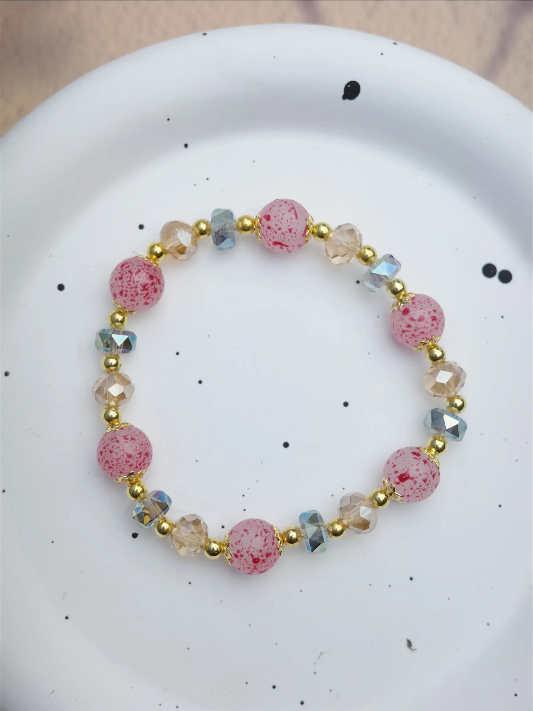 New Chinese-style crystal bracelet with pink speckles; the soft pink tones are gentle and flattering to the skin, exuding a distinct traditional aesthetic—perfect for everyday wear or as a gift.