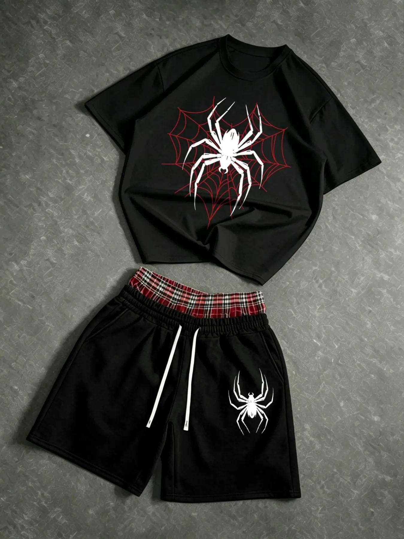 Men's two-piece summer suit: a crew neck spider web pattern T-shirt and a pair of red plaid drawstring shorts with a spider print at the waist. The shorts are double-layered.