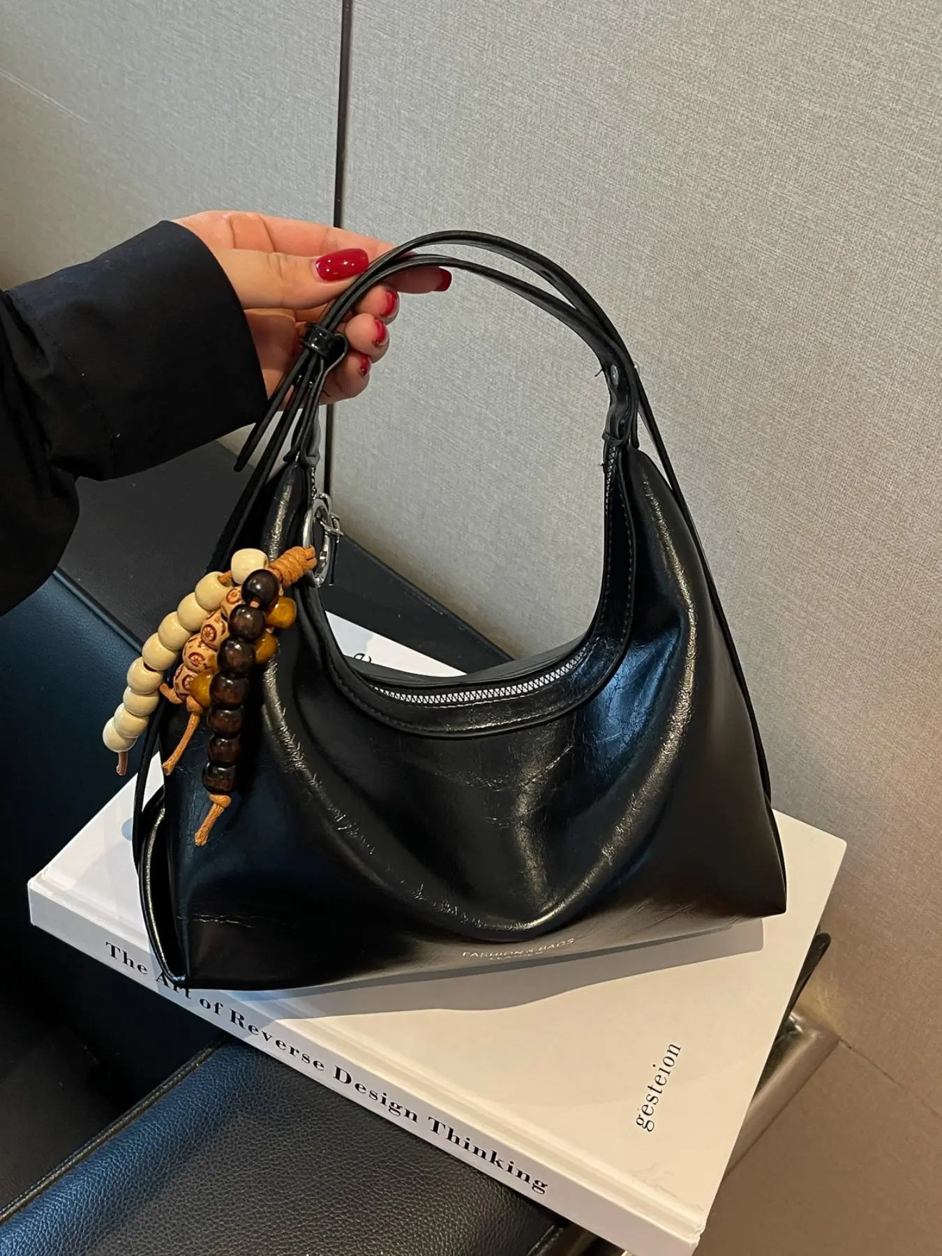 Vintage Wax Leather Crescent Underarm Shoulder Bag, Elegant Folded Texture, Classic Versatile Design, Wooden Bead Pendant, Spacious Interior, Perfect for Daily Use