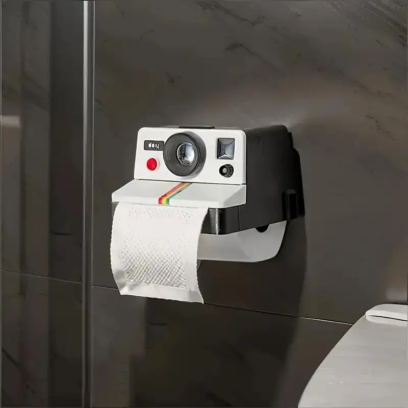 A toilet paper holder with a storage rack, a vintage film camera-shaped tissue box, a traceless tissue holder with a phone stand, bathroom accessories, bathroom organization and storage