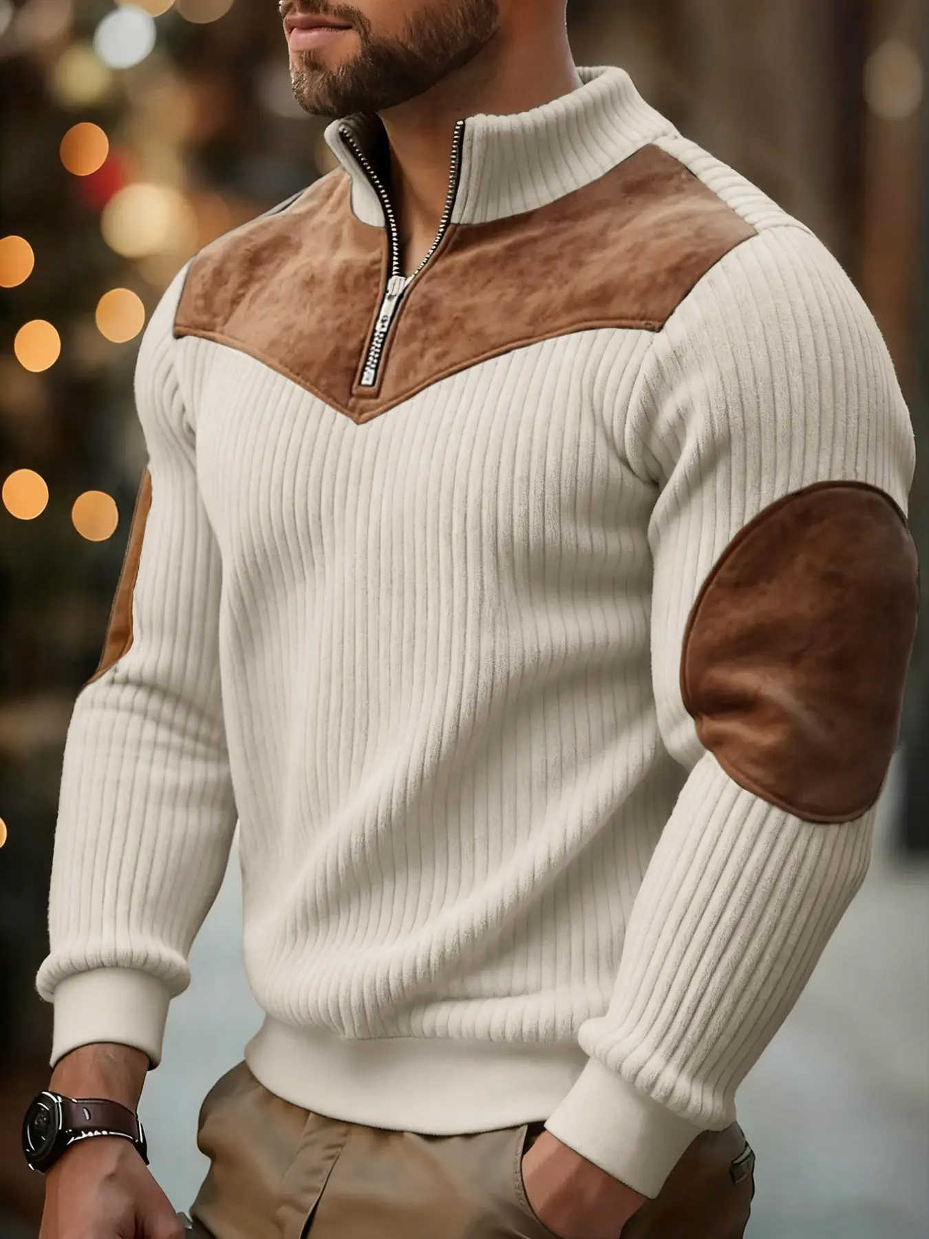 Men's apricot-colored casual long sleeve knit sweater featuring color-block paneling and durable elbow patches with a vertical ribbed texture; a half-zip top perfect for stylish autumn and winter outfits.