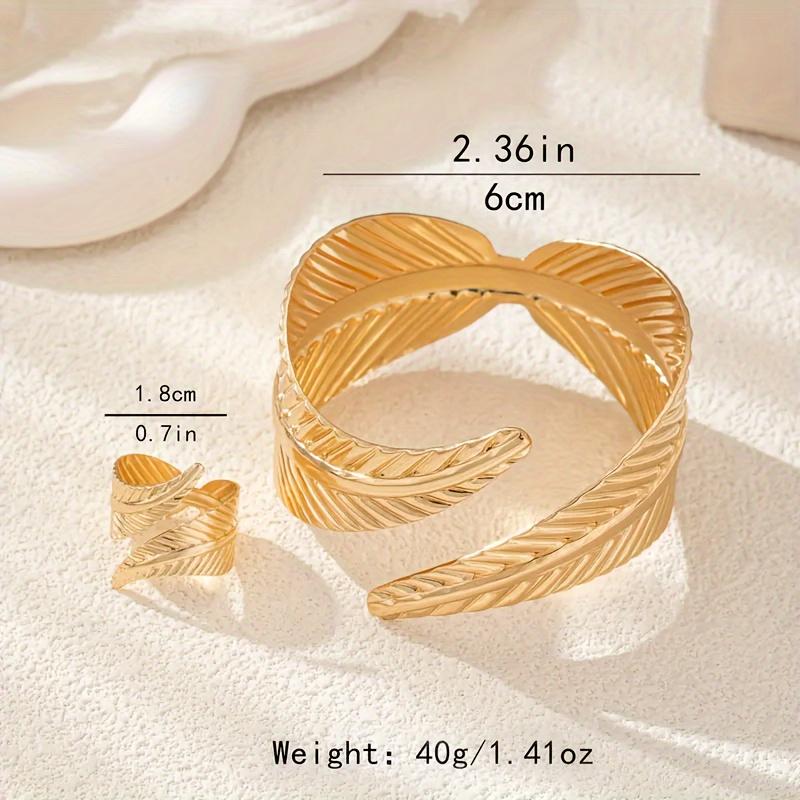 Elegant Gold Feather Textured Cuff Bracelet and Ring Set Nature Inspired Detailed Leaf Pattern Sophisticated Accessory Set for Fashion Enthusiasts and Formal Occasions Cross Necklace Surgical Steel Stud Earrings Mesh Water Drop Plated tiara Silver