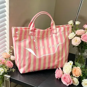 Waterproof striped PVC wash bag with big storage space for skincare and makeup. Handheld design perfect for travel packing and daily toiletries organization for students.