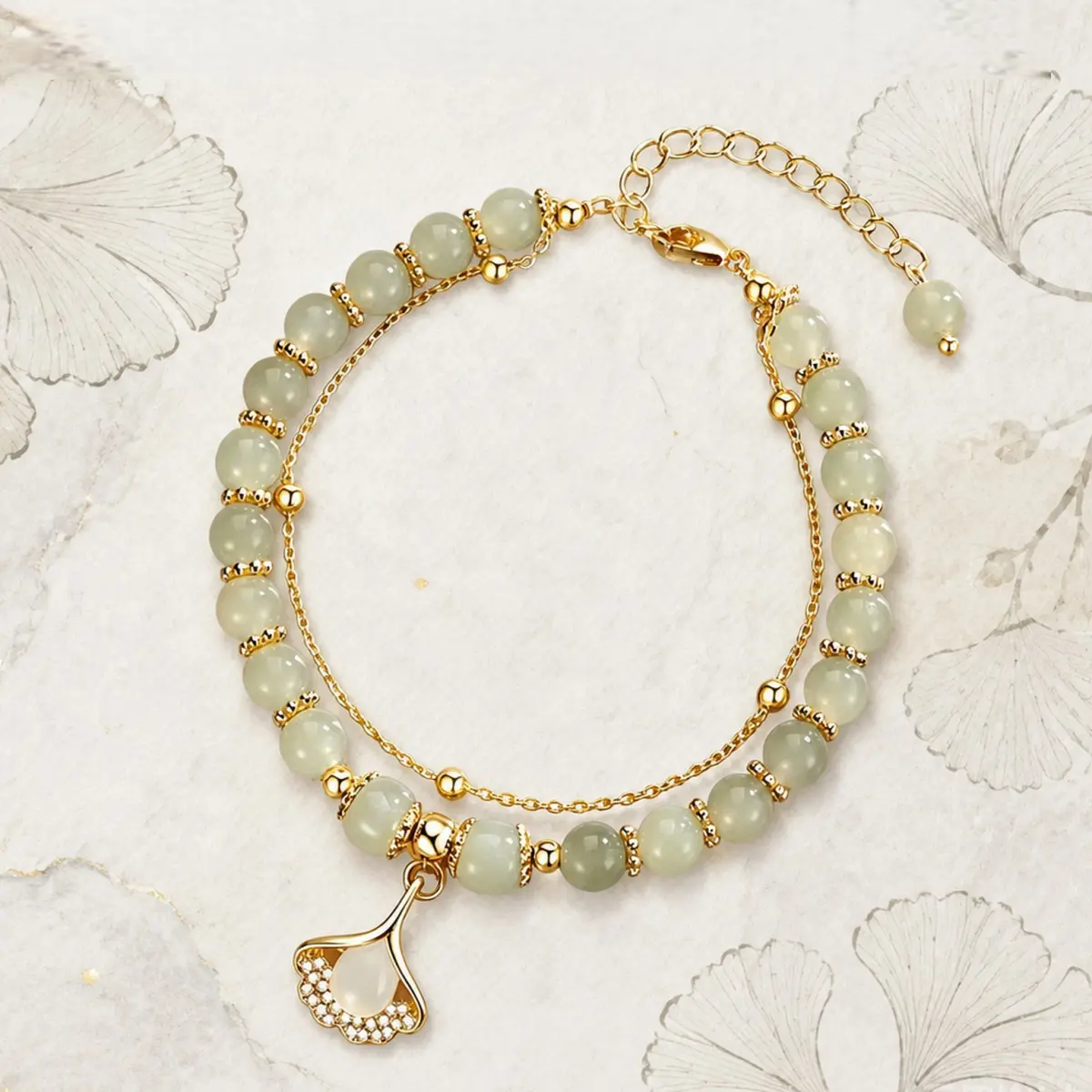 Women Double Layer Natural Hetian Jade Bead Bracelet, 14K Gold Plated Ginkgo Leaf Inlaid Zircon Water Drop Jade Pendant with Adjustable Extension Chain, Soft Translucent Pearl Glow Light Green Jade Wristband, Elegant Oriental Chinese Style Jewelry for Dai