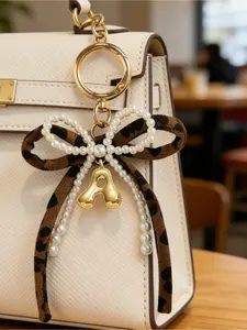 Leopard Print Bow Keychain, Pearl Bow Charm, Bubble Letters A-Z, Elegant Metal Accessory for Backpacks, Wallets, Phone Cases