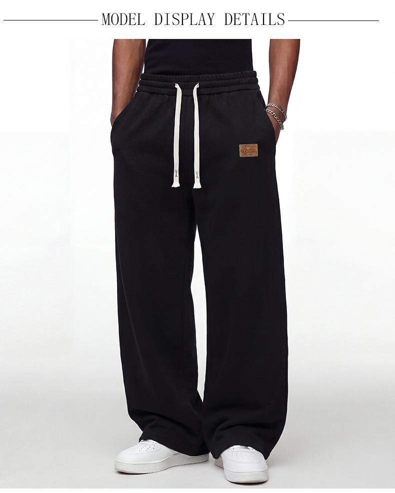 Black loose men's sweatpants, extremely comfortable for daily wear, skin-friendly men's jogging pants, super comfortable with elastic waistband, classic drawstring men's casual sweatpants, suitable for various occasions, and perfect for wearing in autumn
