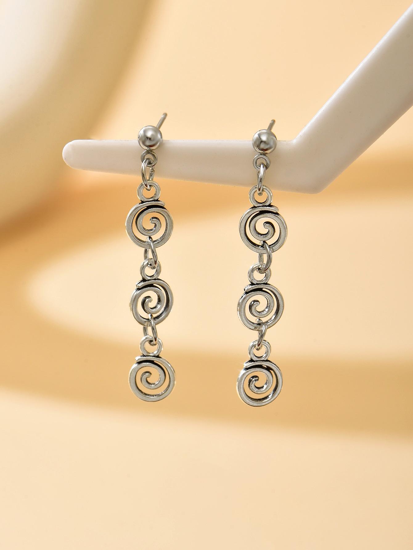 Vintage spiral earrings with distressed design, mosquito incense holder pendant, swirling long fringed earrings