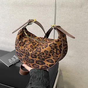 Women's Half-Moon/Dumpling Bag — featuring a multi-pocket design and leopard print, this versatile bag can be worn over the shoulder or crossbody, and comes with an adjustable strap; ideal for travel, commuting, school, and daily use