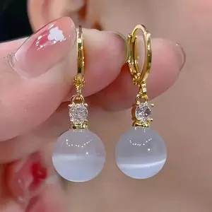 A Stylish Vintage Earring Set with Golden Toned Ring Earrings and Sparkling Details for Casual Attire, Celebrations and Holiday Occasions. Great Gift Choice for Women.