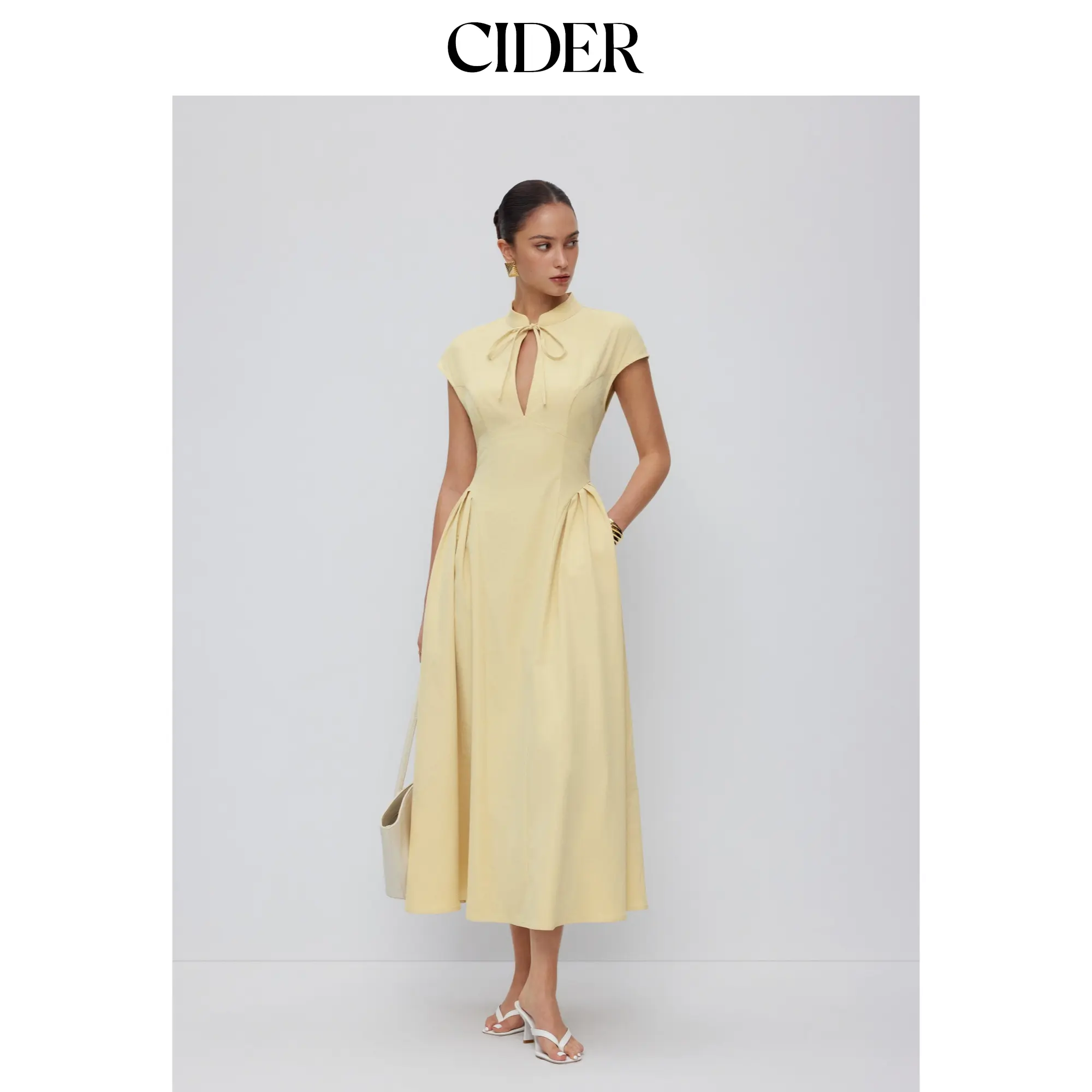 Cider Stand Collar Tie-Neck Short Sleeve Draped Pocket Flared Maxi Dress