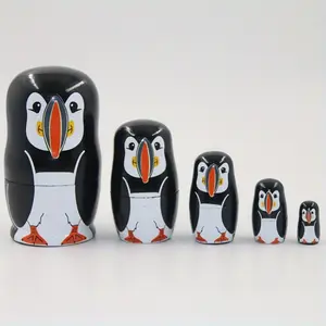 Russian nesting doll with five layers, cute and silly little penguin wooden crafts, ornaments, toys, gifts