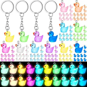 100 Pcs Luminous Mini Duck Keychains Glow in The Dark Resin 3D Tiny Key Chains Bulk Small Animal Pendant for Christmas Party Gifts Birthday Favors Transparent Multicolor