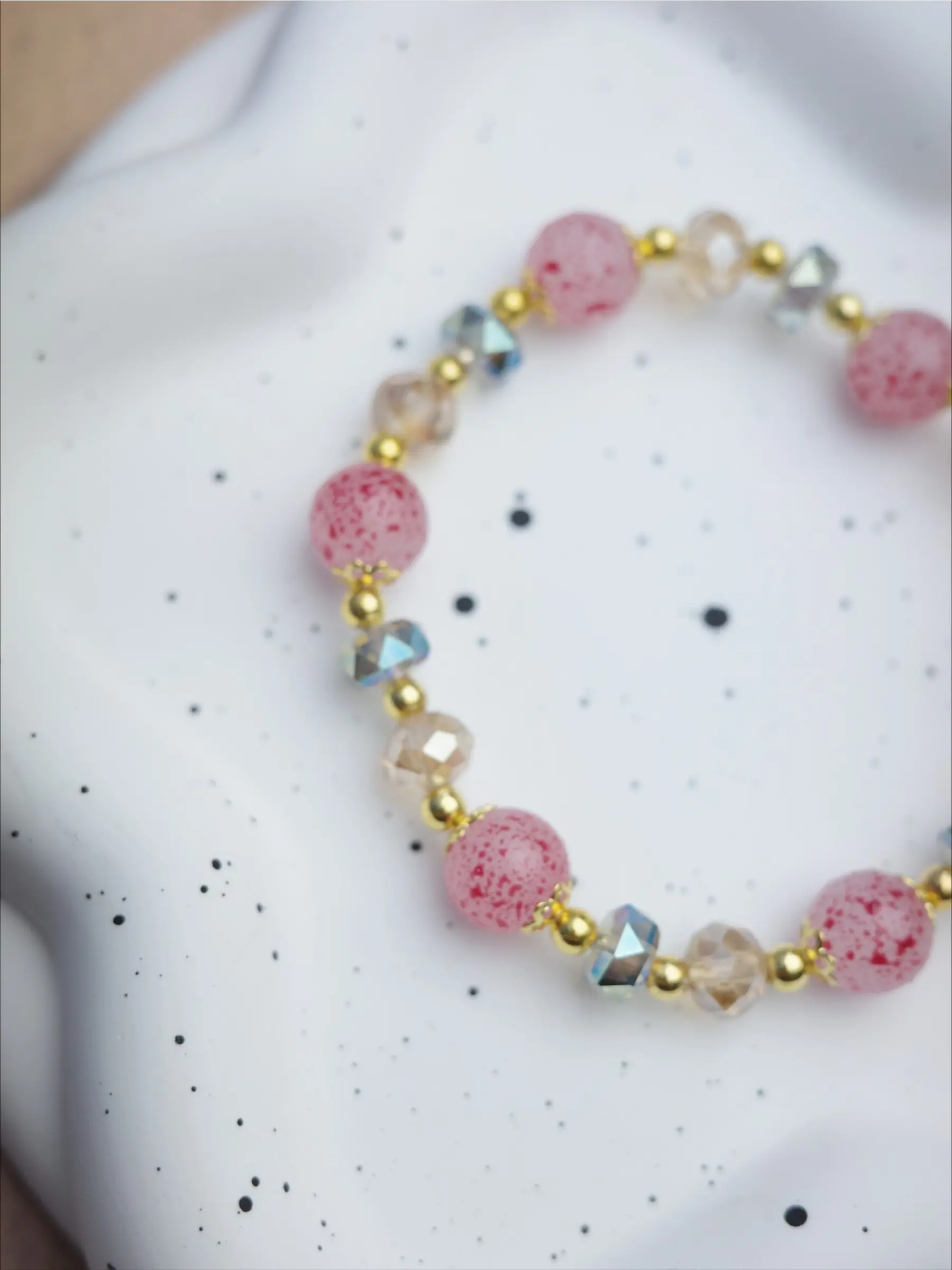 New Chinese-style crystal bracelet with pink speckles; the soft pink tones are gentle and flattering to the skin, exuding a distinct traditional aesthetic—perfect for everyday wear or as a gift.