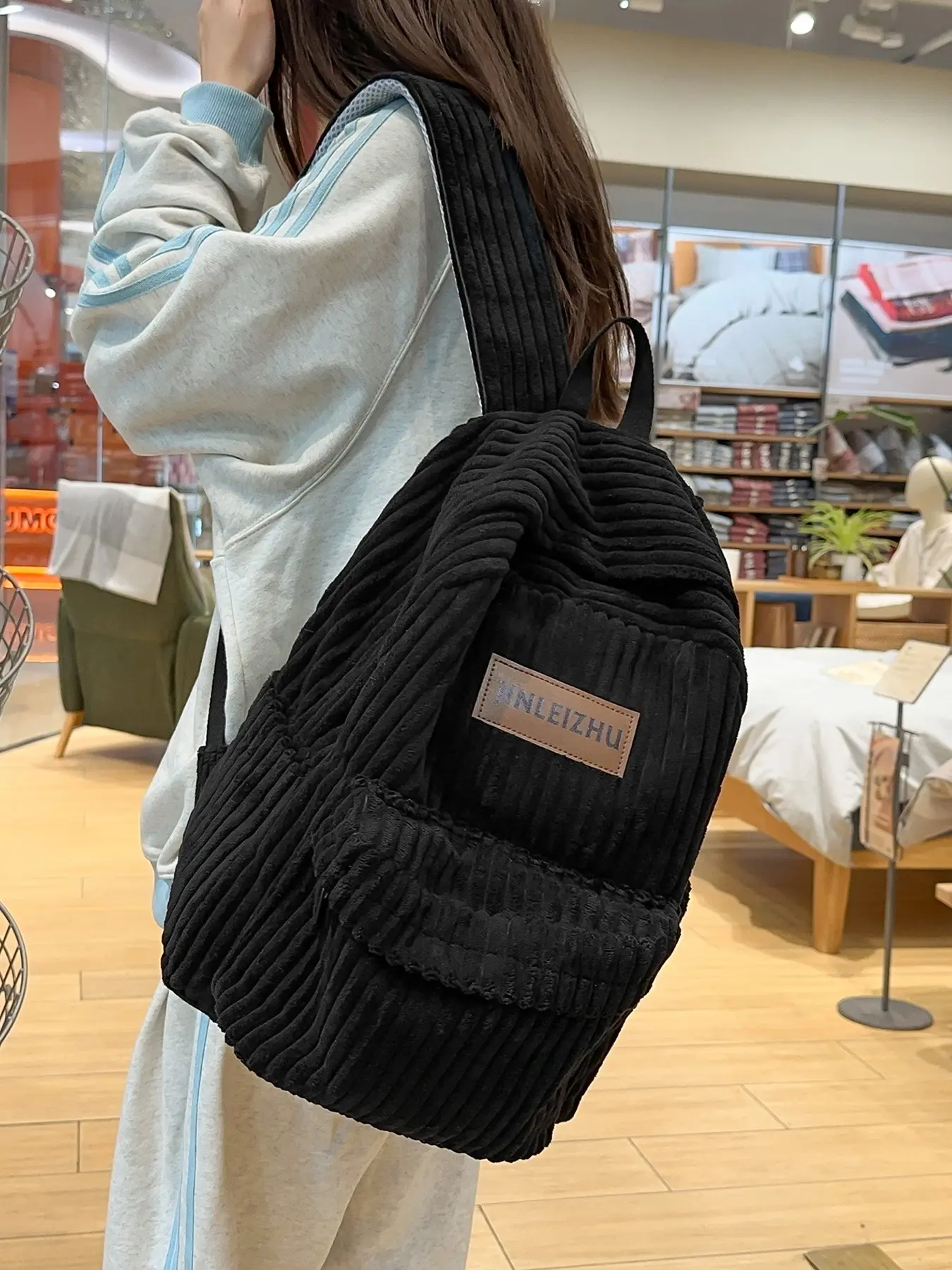 Back-to-school season niche design corduroy vertical stripe backpack with large capacity and weight-reducing shoulder straps, stylish and versatile for commuting, going out, or traveling, available in multiple colors, lightweight backpack.
