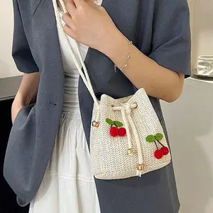 1PC Beige Woven Straw Bucket Bag with 3D Cherries – Lightweight Crossbody Purse. Perfect for Beach, Brunch & Travel. Great Gift for Style-Conscious Women.