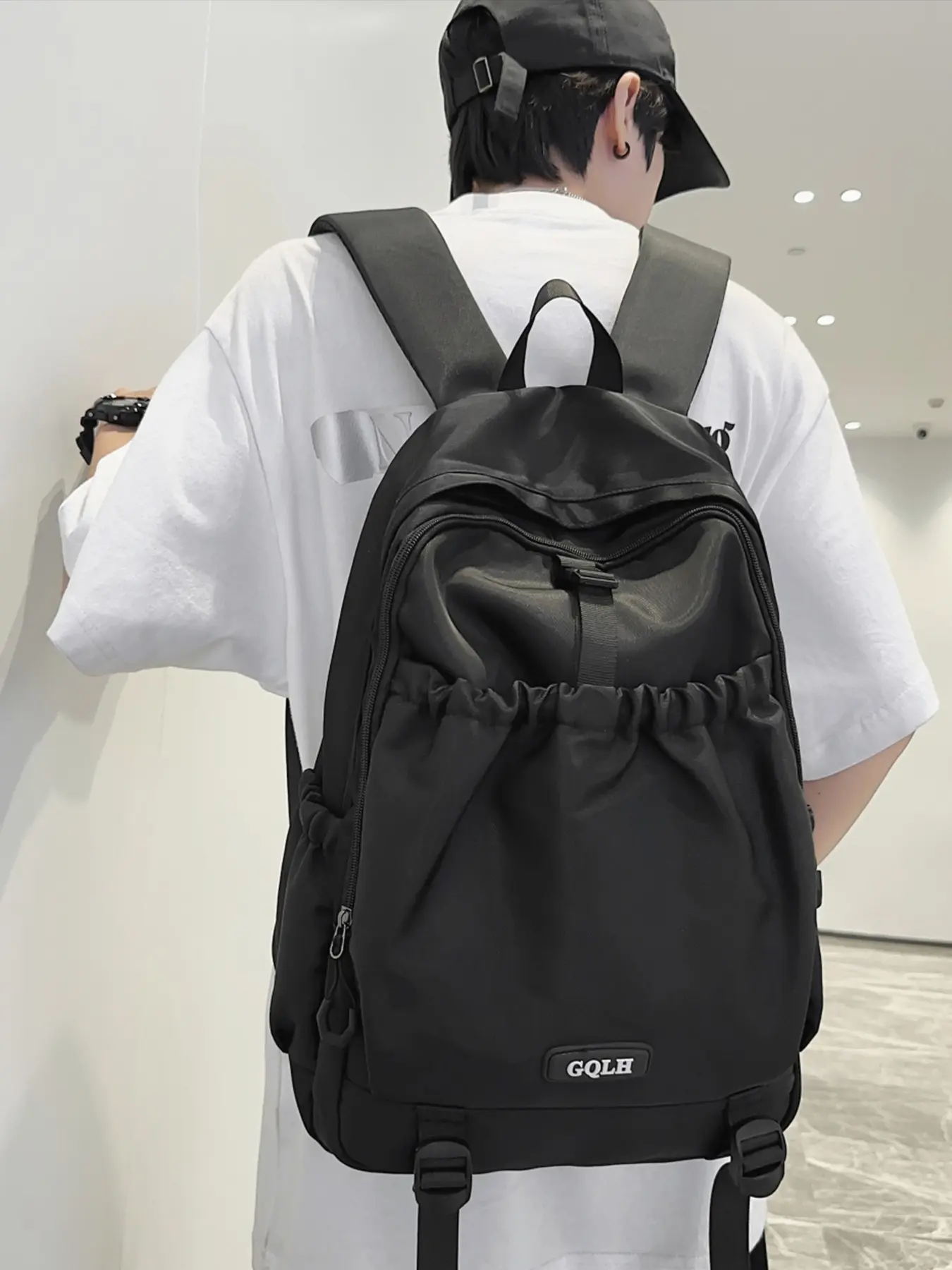 1pc Solid Black Fabric Men Drawstring Front Casual Backpack, Nylon Backpack, Drawstring Gathered Pocket For Water Cups Small Items Top Fabric Handle & Wide Pressure-relief Shoulder Straps Side Zipper Pocket For Keys Earphones Multi-divided Interior