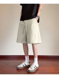 Comfortable Deconstructed Patchwork Diagonal Ice Silk Five-Quarter Shorts for Men, Cool and Stylish Summer Wear, Perfect for Casual
