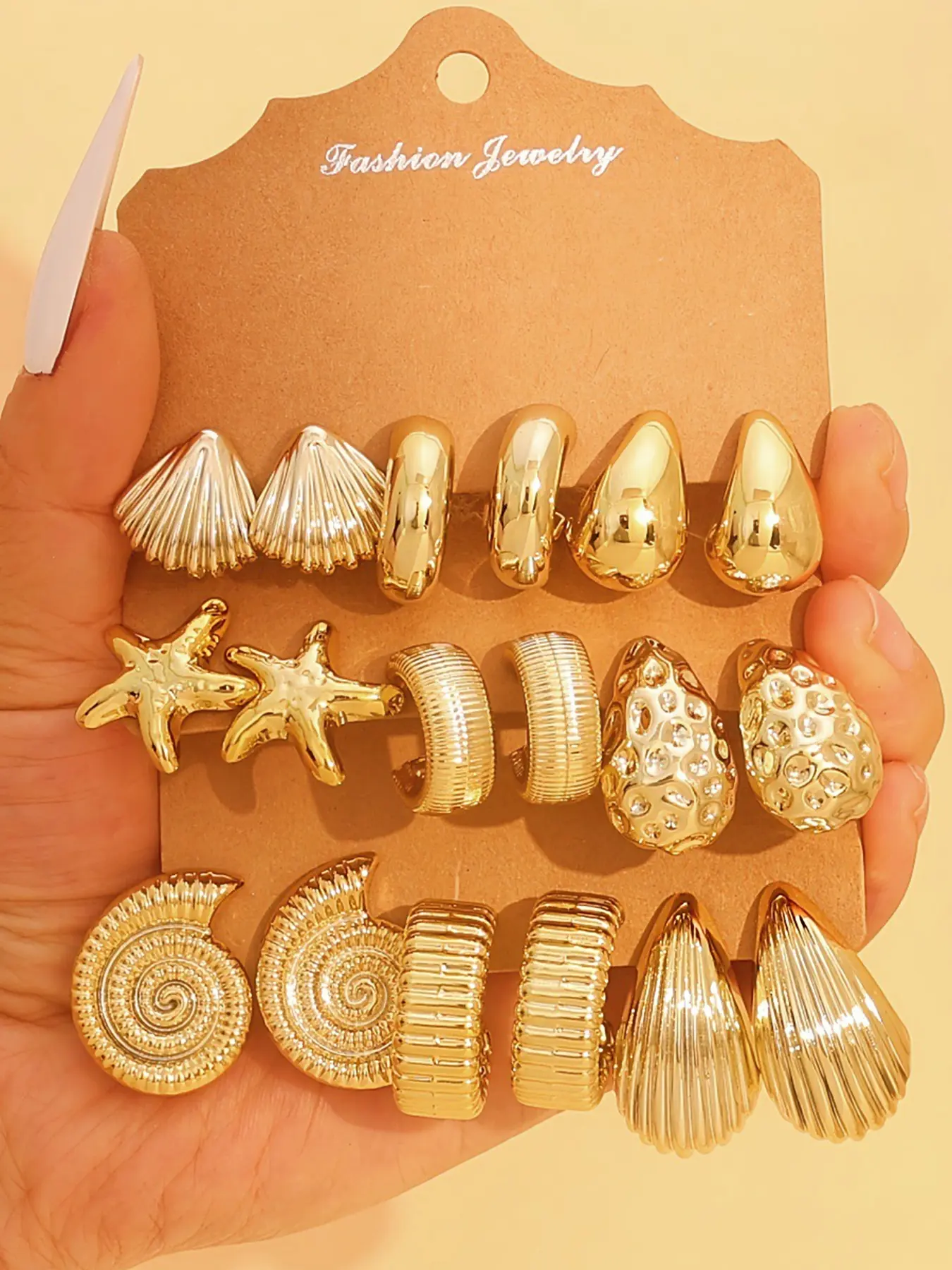 Set of 9 Pairs of Women's Chunky Gold Hoop Earrings, Earring Stacks — Hypoallergenic Stackable Earring Set featuring Thick Open Twisted Hoops, Stylish Gold Starfish, Textured C-Shaped Designs — Perfect for Travel and Vacations