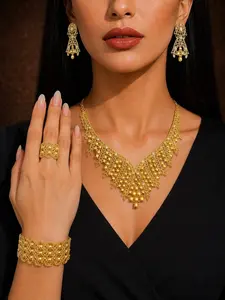 4 piece set of gold-plated ladies jewelry set in Middle East, Africa and India, luxurious and exaggerated style, hollow rhinestone necklace bracelet earrings ring jewelry is suitable for holiday gifts, wedding parties and banquet occasions.