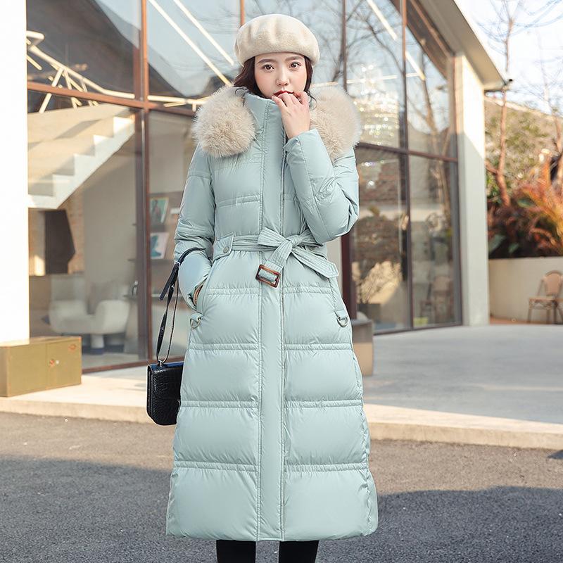 New winter women's thickened long over-the-knee hooded cotton-padded coat with large fur collar.