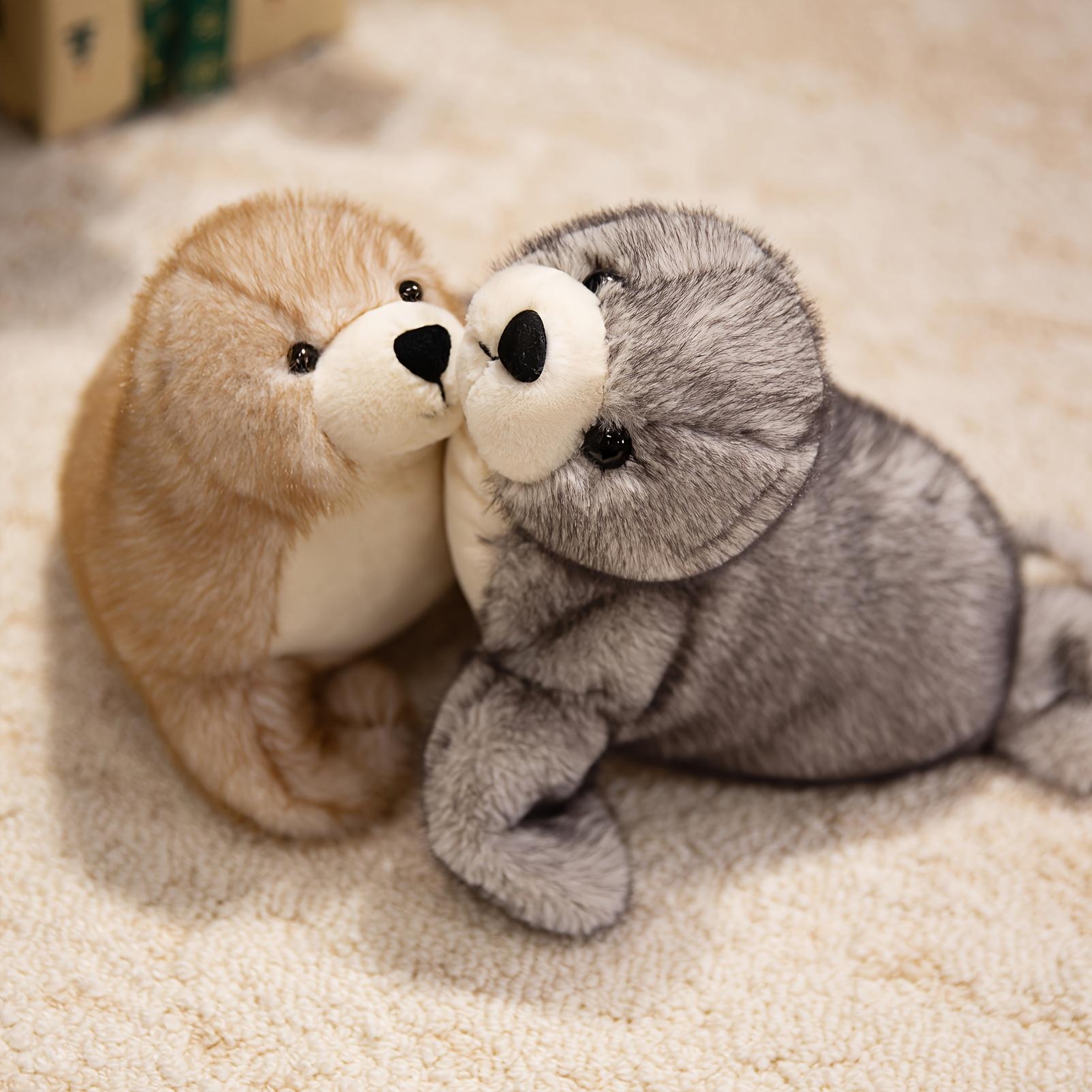 Adorable plush sea lion toy, super soft stuffed animal in a lazy pose, with silky fins suitable for cuddling and sensory play in the nursery