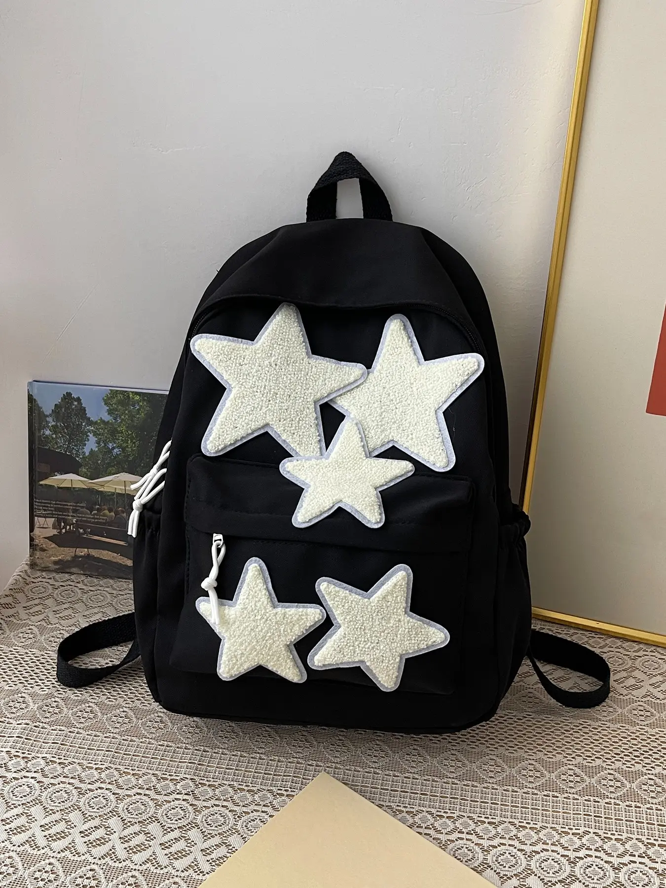 Back-to-school season niche design star backpack with pentagram embroidery, wide shoulder straps to reduce burden, versatile for daily student use, commuting, short trips, and casual lightweight everyday wear.