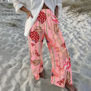 New wide-leg vacation trousers!! Bohemian-style floral print wide-leg pants—high-waisted, pink, and loose-fitting—perfect for a casual holiday look.