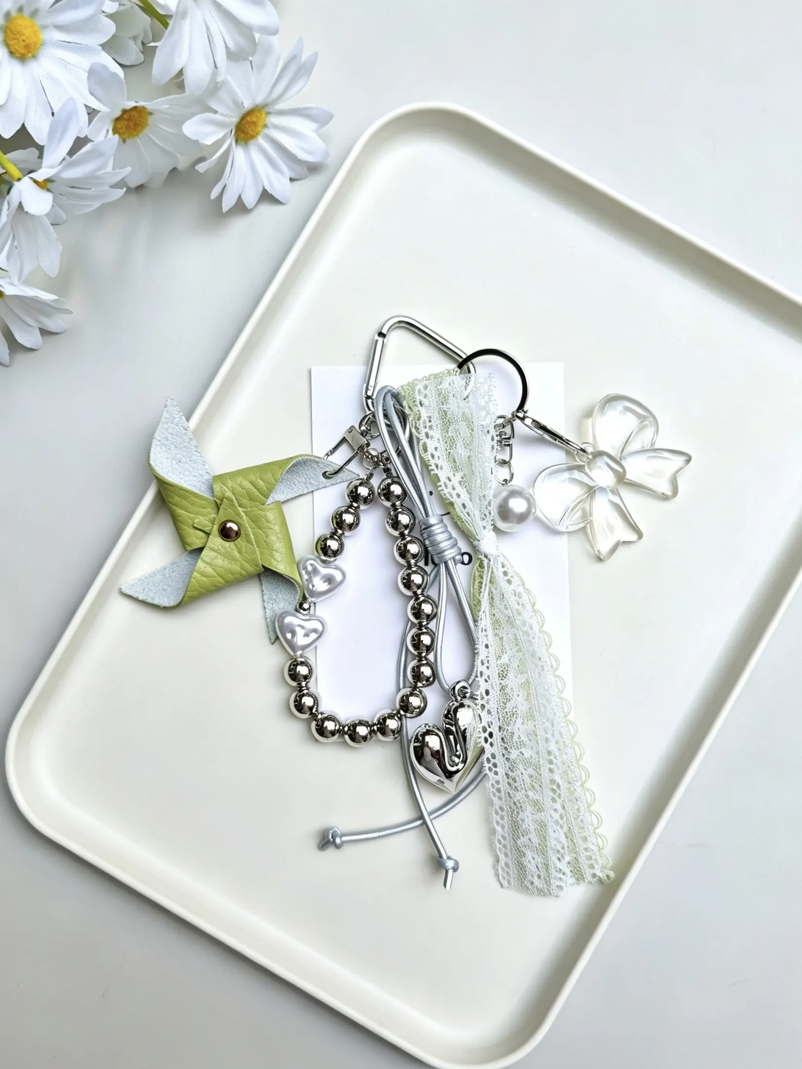 Retro heart-shaped denim keychain with a unique fringed woven cord, alloy openwork flower key, leather cord paired with jelly cube beads—perfect for women's backpacks and handbags, ideal for daily commuting