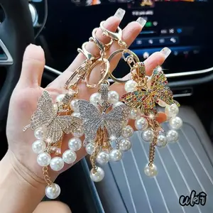 Pearl Linked Butterfly Keychain Inlaid With Rhinestone Details, Stylish Multipurpose Pendant For Automobile Keys And Handbag Embellishment As Thoughtful Presents For Family And Friends
