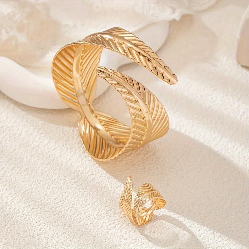 Elegant Gold Feather Textured Cuff Bracelet and Ring Set Nature Inspired Detailed Leaf Pattern Sophisticated Accessory Set for Fashion Enthusiasts and Formal Occasions Cross Necklace Surgical Steel Stud Earrings Mesh Water Drop Plated tiara Silver