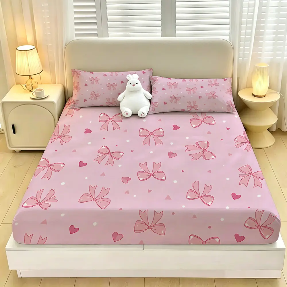 A 3-piece digital-printed bedding set featuring pink bows and hearts, including one bedspread and two pillowcases, without a filling. The bedspread is soft and comfortable, with a deep pocket design, making it a perfect gift choice.