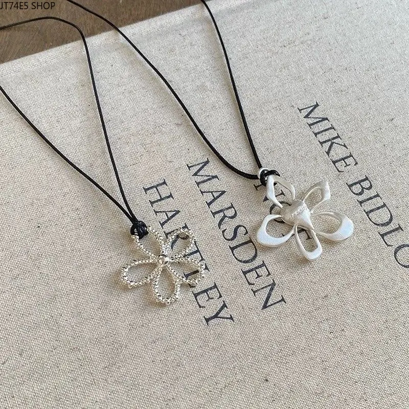 Elegant Hollow Flower Necklace with Black Cord, a Minimalist Adjustable Length Sweater Chain for Casual Daily Wear, Adjustable Length Necklaces, Flowers, Korean Ins, Long, Metal Coated, Pendant, Hollow Carved, Pull-Adjustable Drawstring