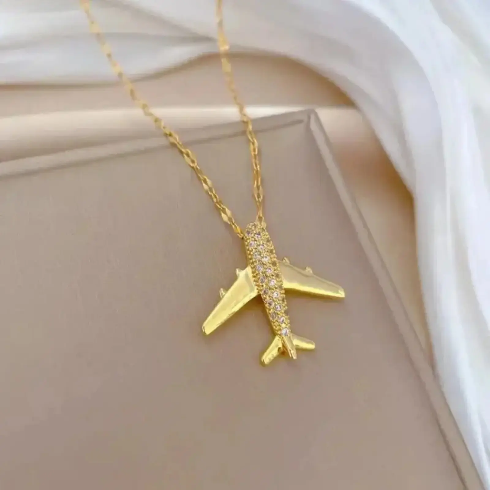 Gold Plated Necklace with delicate airplane & starry sky pendant, paired with statement chain. Stylish fine jewelry, ideal gift for outdoor and sports lovers for daily wear.