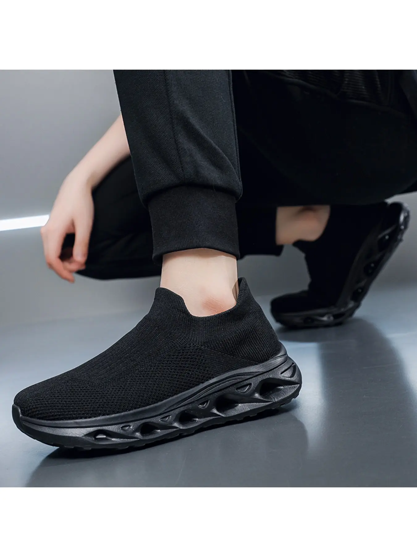 A pair of men's slip-on no-tie sock shoes, super breathable with hollow mesh, shock-absorbing sole, perfect for hiking, walking the dog, and summer vacations.