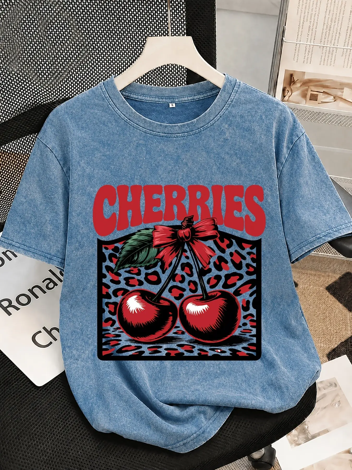 Vibrant retro fruit and leopard print heat-transfer Graphics T-shirt; relaxed, laid-back style; soft, Light Wash washed-finish fabric; versatile for Everyday short trips or lounging at home and casual outings.