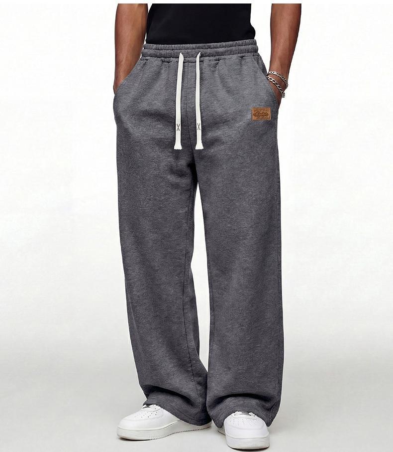 Black loose men’s sweatpants, extremely comfortable for everyday wear, skin-friendly men’s joggers, super comfortable with an elastic waistband, classic drawstring men’s casual sweatpants, suitable for various occasions, and perfect for wearing in spring