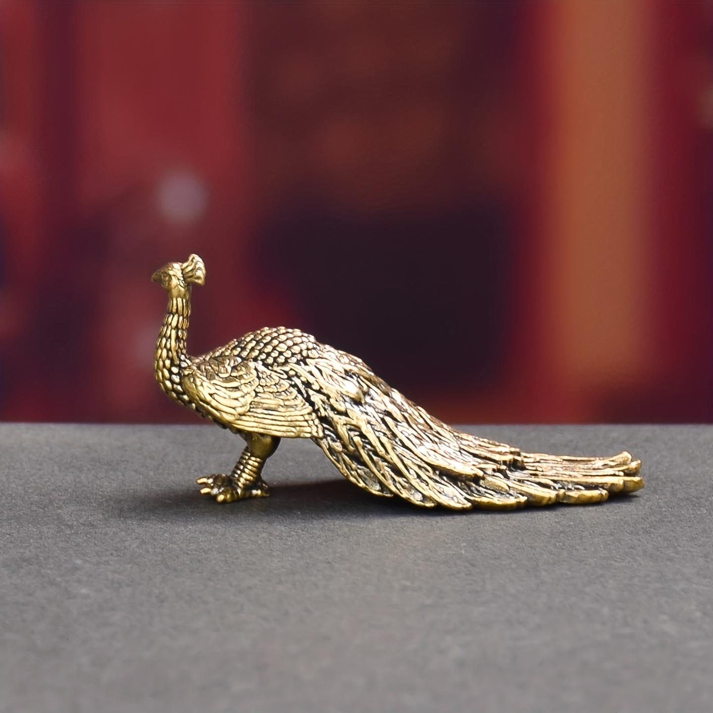 A vintage-style brass peacock desktop ornament—an exquisite piece of craftsmanship ideal for collectors. It makes a perfect birthday gift, a charming addition to an office bookshelf, or a unique decorative accent for a Halloween display.